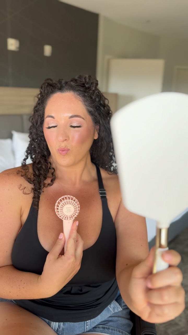Wedding client smiling after makeup application