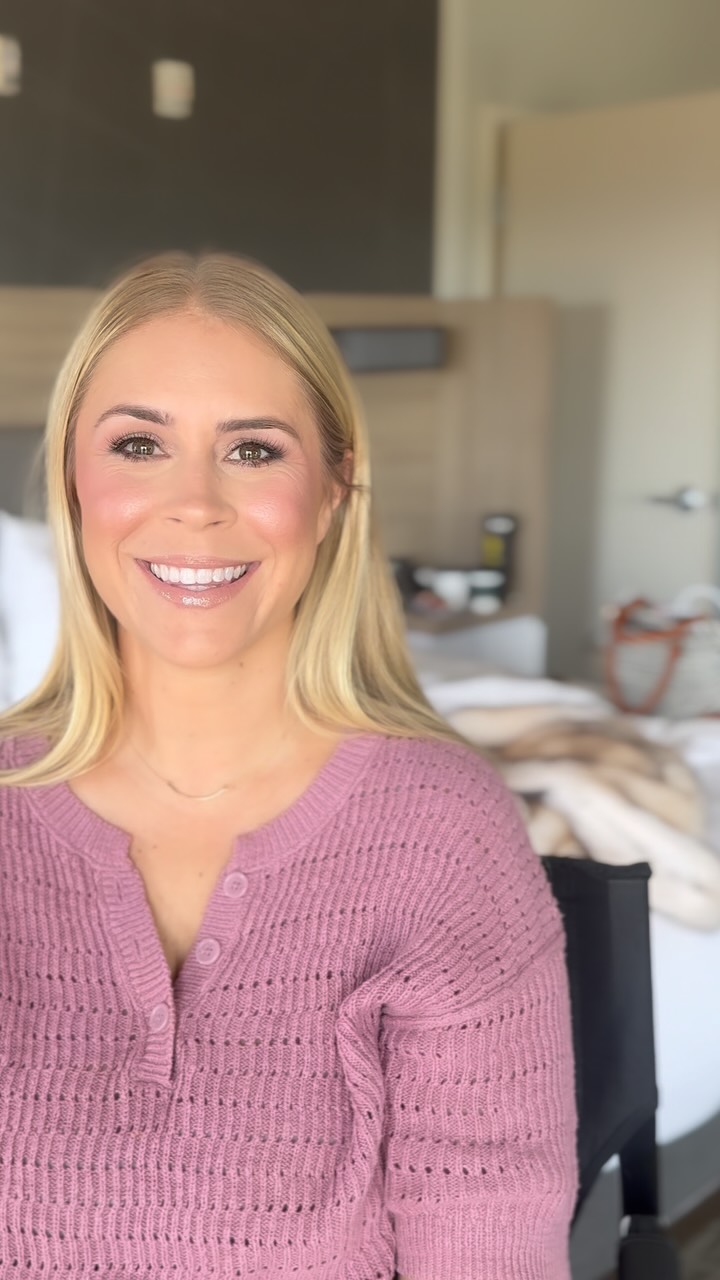 Smiling blonde bridesmaid with softly polished makeup
